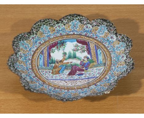 A Persian enamel plate, 26cm diameter