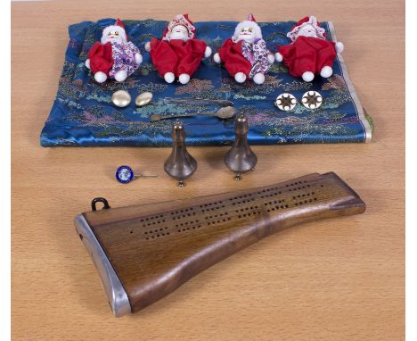 A cribbage board made from a rifle stock together with four miniature porcelain head dolls and other items