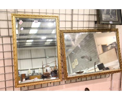 Gilt framed bevelled edge mirror, 84 x 60 cm and a further gilt framed wall mirror, 72 x 50 cm. Not available for in-house P&