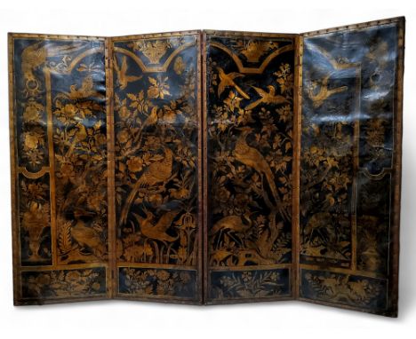 A late 18th / early 19th century Continental four panel modesty screen, the exotic bird decorated panels of embossed and gild