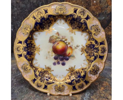 A Royal Worcester shaped circular plate,&nbsp; painted by F (Frank) Roberts, signed,&nbsp;with ripe peaches and blueberries, 