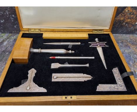 A silver plated Masonic Lodge tool set, by Toye &amp; Co, comprising various tools, ruler,&nbsp; gavel, 20cm W, set squares, 