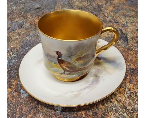 A Royal Worcester demi-tasse cup and saucer,&nbsp; painted&nbsp;by&nbsp;James Stinton signed, with a brace of pheasants, gilt