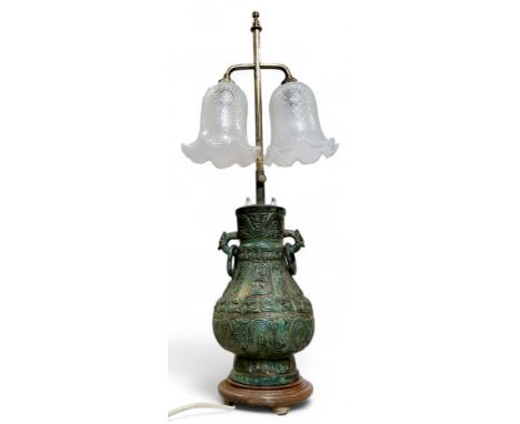 A 'Chinese' Archaic bronzed side light, cast with symbols and character marks, loose ring handles, opaque glass shades, adjus