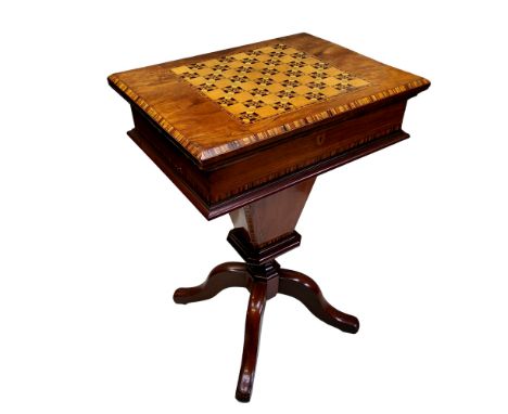 A Victorian walnut work/games compendium,&nbsp; inlaid in coloured woods with chessboard, conforming banded borders, trumpet 