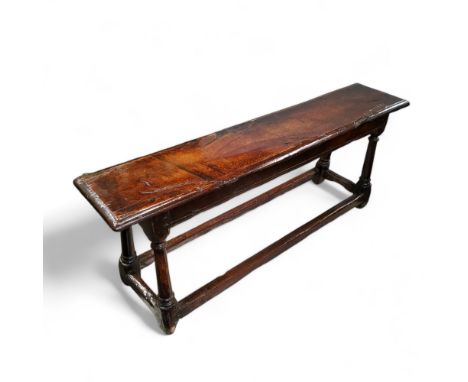 A mid 17th century English oak joint stool bench,46cm high, 121cm wide, 25cm depth 