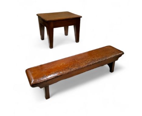 A 19th century long low bench stool, trestle base, 18cm high,&nbsp; 71cm long;&nbsp; &nbsp;a mahogany stool, 19cm high, 25cm 