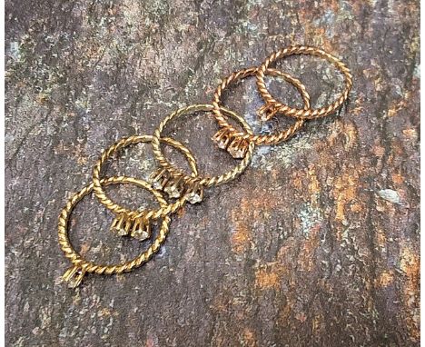 A 9ct gold and rose gold and diamond stacking rings each claw set with either one, two or three diamonds, approx. total diamo