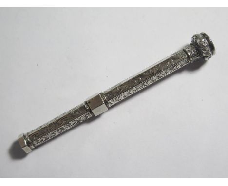 A Large Silver Propelling Pencil with chased foliate scroll decoration and amethyst matrix 