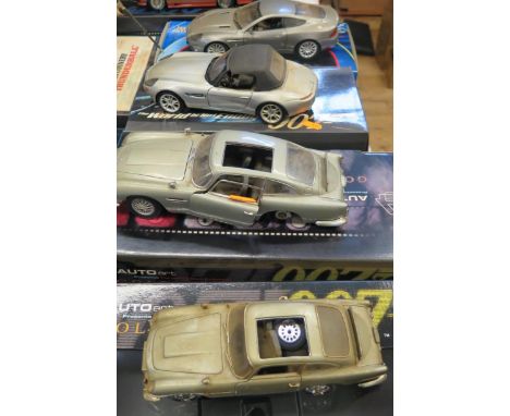 Four James Bond 007 Scale Model Cars Boxed with faults. One wrong box 