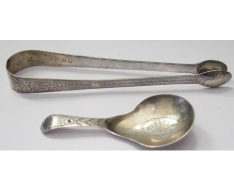 A George III Bright Cut Silver Caddy Spoon, London 1789, George Burrows and a pair of bright cut silver sugar tongs, 25g 