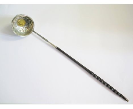 A Fine George II Silver Toddy Ladle with embossed harebell swag decoration and set with 1746 Gold Guinea, 37cm long 