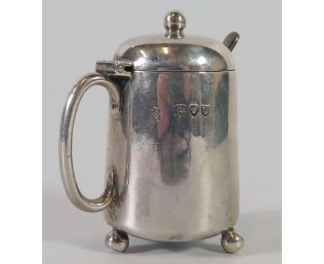 A Victorian Silver Mustard Pot with blue glass liner, London 1895, William Hutton, 73g and plated spoon 