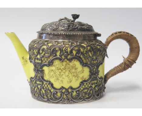 A Victorian Silver Mounted Crown Staffordshire Teapot, the pierced mount with foliate scroll decoration, Birmingham 1895, Wil