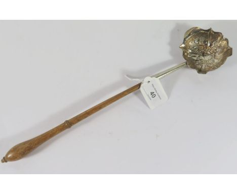 A George II Silver Toddy Ladle with embossed foliate decoration, London 1747, maker indistinct, 36cm long 