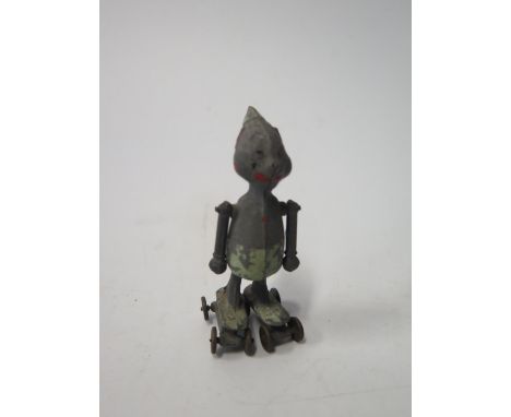 An Unusual Articulated Lead Roller Skating Figure (7cm High) 