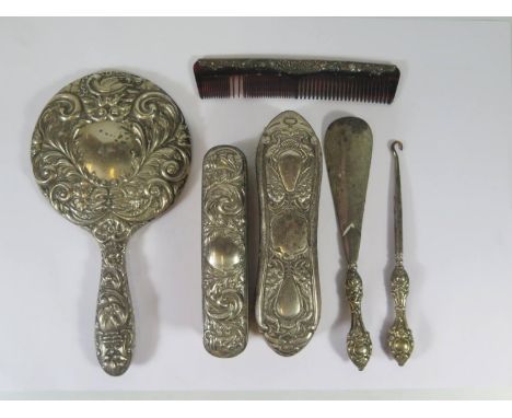 A Silver Backed Hand Mirror, brush and comb, shoe horn and button hook 