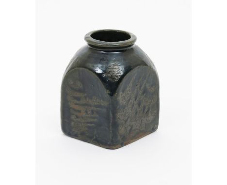 Bernard Leach (1887-1979) a Leach Pottery stoneware vase, square section with circular rim, resist decorated in green over br
