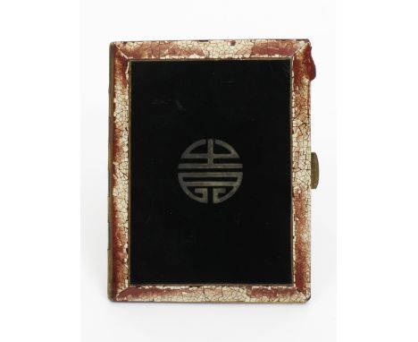 A silver-gilt enamelled cigarette case,  rectangular, hinged cover, black enamel with geometric Mon to the centre, the rim bo