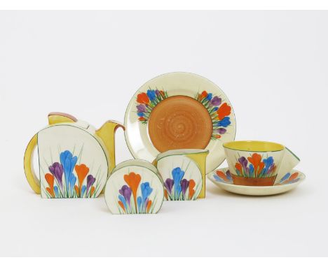 'Crocus' a Clarice Cliff Bizarre Bachelor tea set for one, comprising Stamford tea pot and cover, milk-jug and sugar basin, o