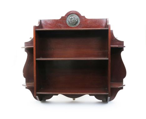 An Arts and Crafts mahogany wall-mounted  display shelf possibly Shapland & Petter,  the back inset with patinated metal fish
