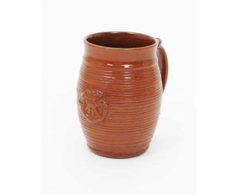 •David Leach (1911-2005) an early earthenware tankard possibly Leach Pottery, swollen barrel form with applied handle and Cor