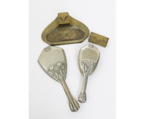 A Secessionist silver hand-mirror and hairbrush, cast in low relief with geometric design, a Secessionist patinated brass ink