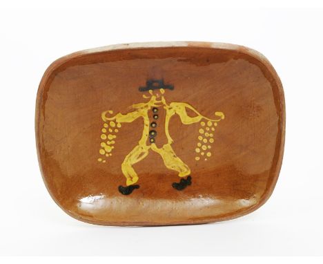 Bernard Leach (1887-1979) attributed a Leach Pottery Onion Seller slip decorated dish, painted in shades of brown and white o