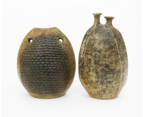 John Verando  a large stoneware vase, dated 1969, amorphic form with twin necks, covered with a running ash glaze, and anothe