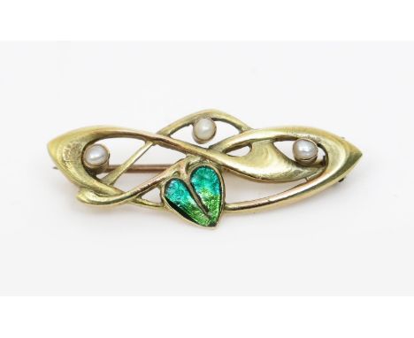 A Liberty &amp; Co 9ct gold enamel and seed pearl brooch designed by Archibald Knox, made by W H Haseler, modelled as an Art 