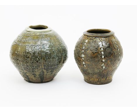 Mike Dodd (born 1943) an ovoid stoneware vase, with fluted decoration, covered in a pitted celadon glaze, and another smaller