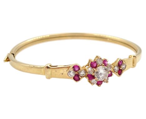 Gold cubic zirconia and pink stone set bangleCondition Report:Tested to 16ct, approx 7.45gm, inner circumference = 17cm, a fe