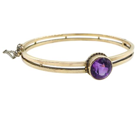Early 20th century gold single stone round amethyst hinged bangleCondition Report:Approx 13.55gm, tested to approx 10.5ct, in
