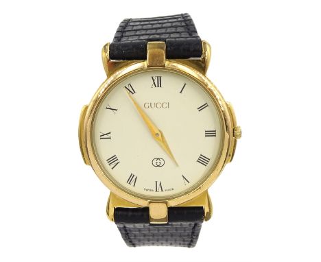 Gucci gentleman's gold-plated and stainless steel wristwatch, model No. 3400M, on original black leather strap, boxedConditio