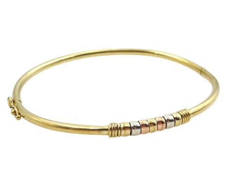 9ct gold gold hinged bangle, with rose, yellow and white gold spinner decoration, hallmarkedCondition Report:Approx 4.85gm, i