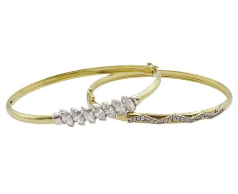 Two 9ct gold cubic zirconia bangles, both hallmarkedCondition Report:Approx 11.15gm, both with some light damage, split to in
