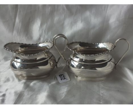 Boat shaped cream jug with beaded rim, also a  matching sugar basin, 6.5" over handles Lon  1934/5 by WB 410g.       