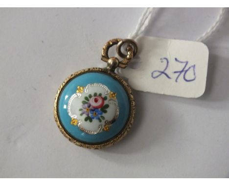 An attractive enamel and gold antique  pendant with hair compartment to back 2cm dia   