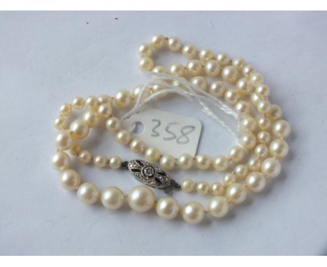 String graduated pearls with 9ct. white gold clasp,  17" long         