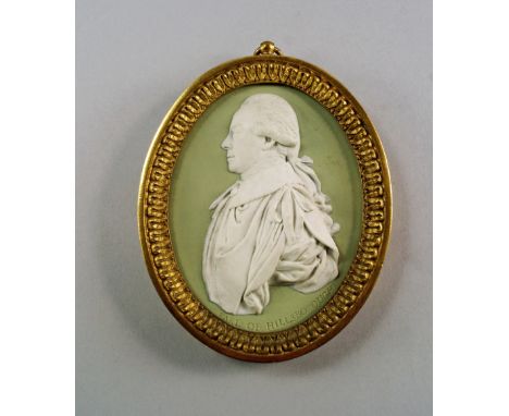 A Wedgwood sage green jasperware oval plaque of the Earl of Hillsborough, late 18th century, modelled by Charles Peart with a