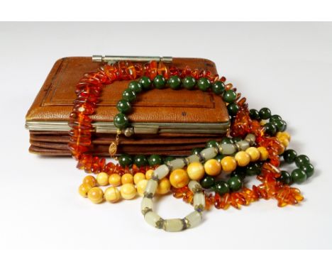 A quantity of beads to include a dark green jade bead necklace with 14ct gold clasp, various strings of beads including lapis