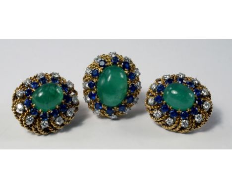 An emerald, sapphire and diamond cluster ring and matching clip earrings, c.1970, the large central cabochon emerald with a s