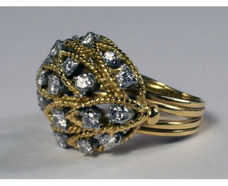 A yellow metal and diamond set ring, c.1960s, of domed leaf form, scattered with brilliant cut diamonds, tests as 18ct, appro