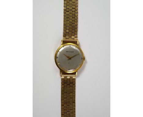 A Jaeger LeCoultre 18ct gold cased gentleman's manual wrist watch, with silvered dial, gold batons and black Arabic numerals 