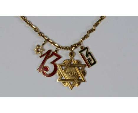 A 9ct gold cable link chain, hung with various charms and pendants, including an 18ct gold number 13 by Cartier, with red and