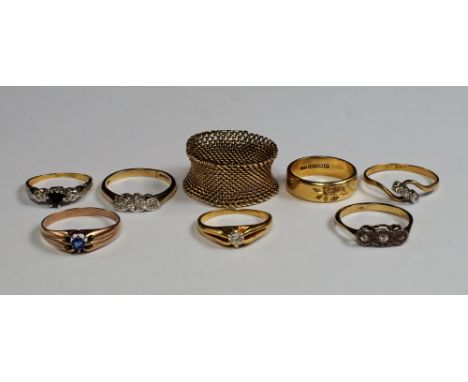 A collection of eight gem set rings, to include an 18ct gold wedding band, with bright cut flower design, set with diamond ch