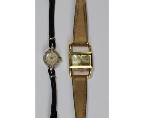 An 18ct gold cased Jaeger -LeCoultre ladies wrist watch, the rectangular case with exaggerated lugs, together with a platinum