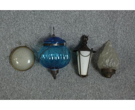 An assortment of lightshades including an Art Deco frosted flame and a blue Moroccan hanging lantern. Four shades in total. T