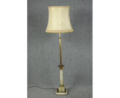 Brass standard lamp with a marble base and shade. Mid twentieth century. H.167cm. 