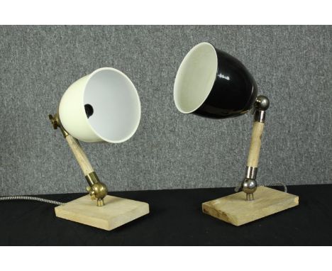 Two wall mounted bedside lamps. Brass and wood with ceramic shades. Each measure H.20 Dia.10 cm. 